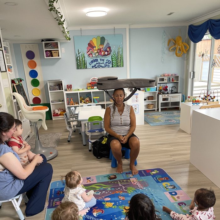 Circle time with caregiver and children